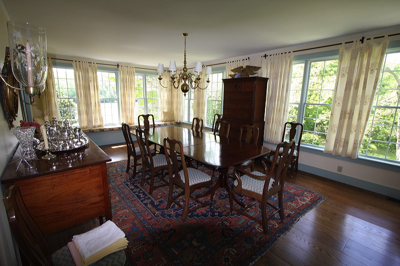 Painted interior dining room, with wood floors.