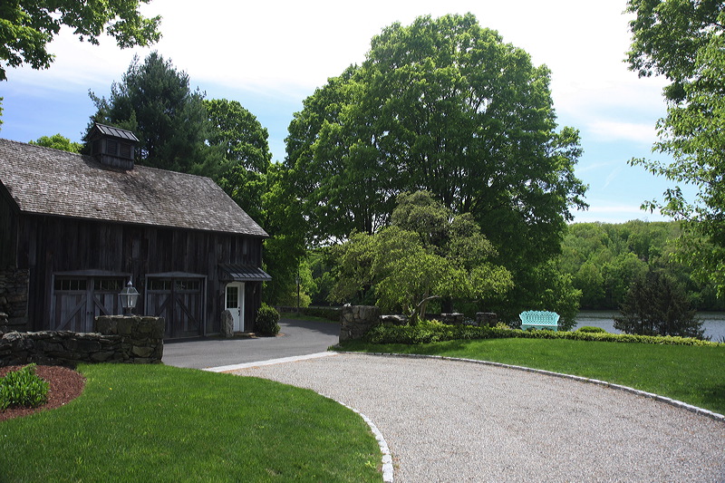 View of the barn with water in the background.