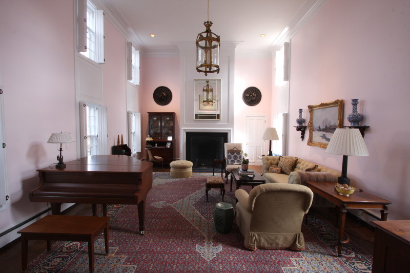 Another photograph of the living room with painted vaulted ceilings.