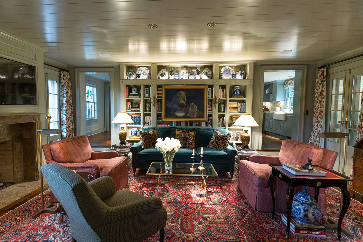 Painted living and sitting area, with painted bookshelves in the background.