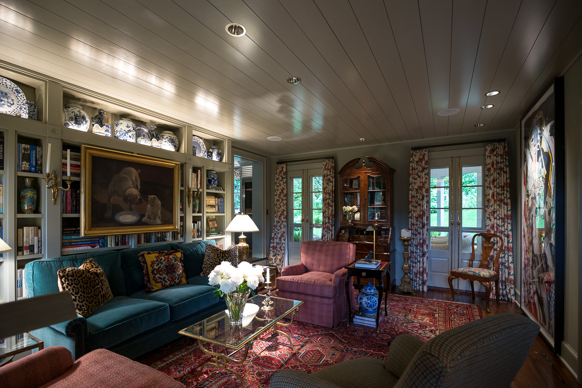 Living room painted walls contrasted against window drapes.