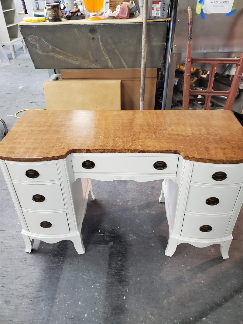 Refinished wood top dresser with painted cabinets.