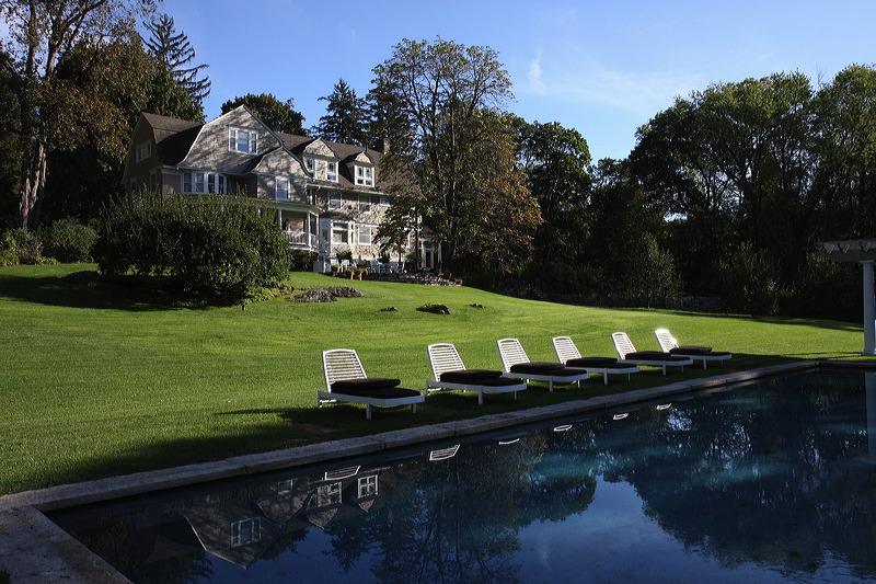 Exterior and grounds of painted house in Washington, CT.