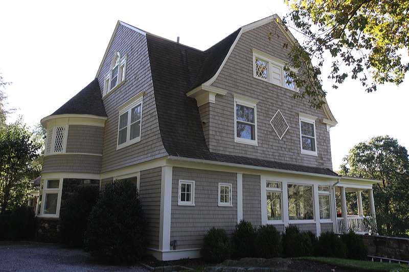 Closeup side angle photograph of painted exterior of the house in Washington, CT.