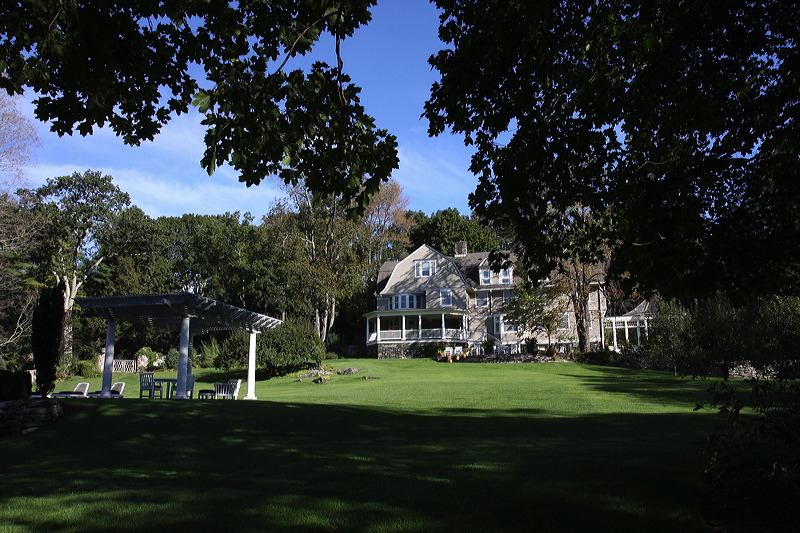 A far-angle shot of the house from the yard.